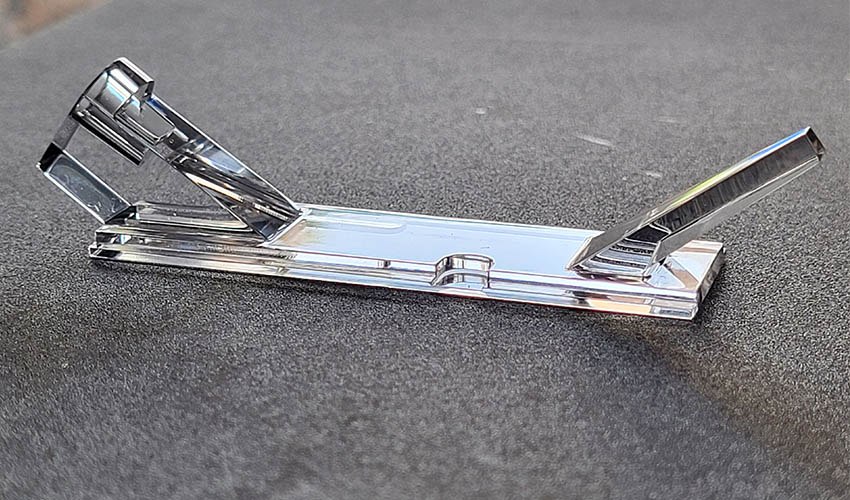 Image of a custom optical light guiding bridge manufactured by EXXELENS laying on its back